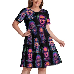 May include: Black skater dress with a repeating pattern of colourful monster portraits. The dress has short sleeves and a scoop neckline. The monsters include Frankenstein's monster, the Creature from the Black Lagoon, and Dracula. The dress is a knee-length style.