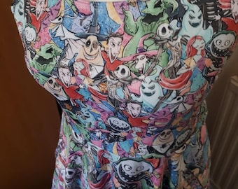 May include: A sleeveless dress with a colorful all-over print featuring characters from the Nightmare Before Christmas movie. The dress has a scoop neck and a fitted bodice with a flared skirt.