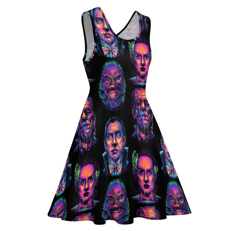 May include: A black sleeveless dress with a colorful print of various monster faces. The print features a variety of colors, including pink, purple, blue, and green.