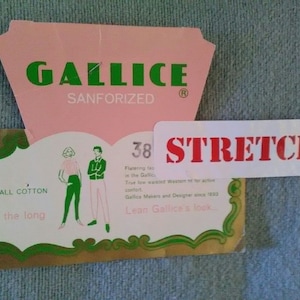 May include: A pink and green label with the text "GALLICE SANFORIZED" and "STRETCH" in red. The label also features a drawing of two people wearing pants and the text "ALL COTTON the long 38".