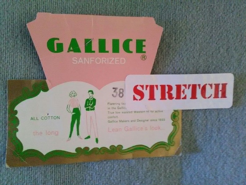 May include: A pink and green label with the text "GALLICE SANFORIZED" and "STRETCH" in red. The label also features a drawing of two people wearing pants and the text "ALL COTTON the long 38".