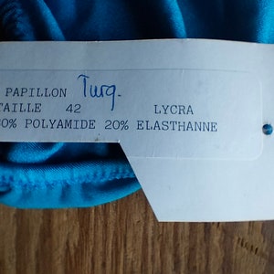 May include: White tag with blue writing, "Papillon", "Taille 42", "80% Polyamide 20% Elasthanne", "Lycra".