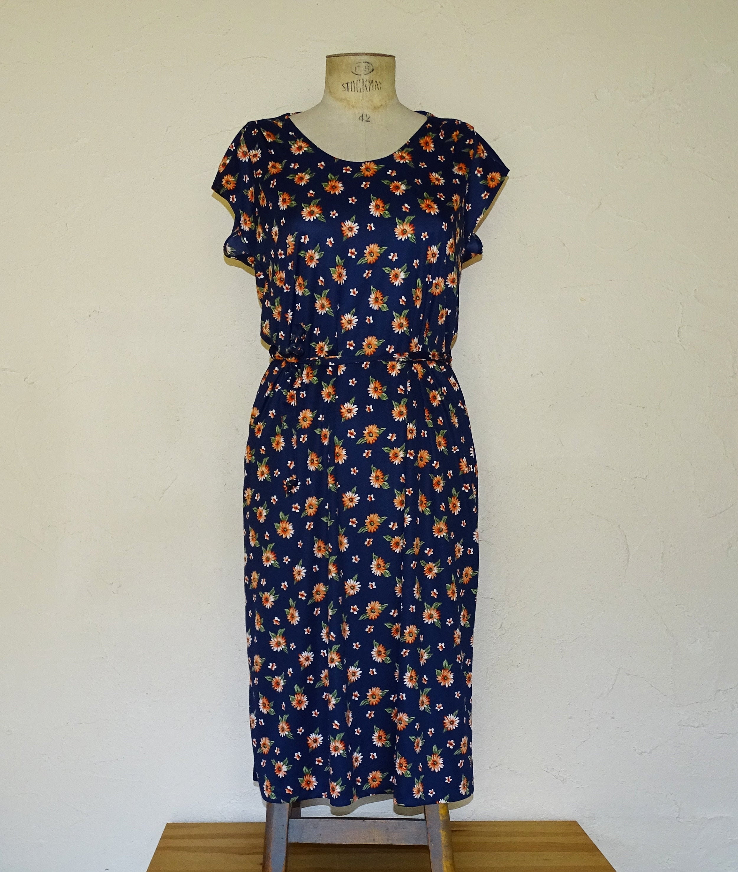 Navy dress with orange cheap flowers