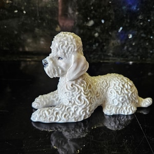 Rosenthal porcelain white lying poodle.
