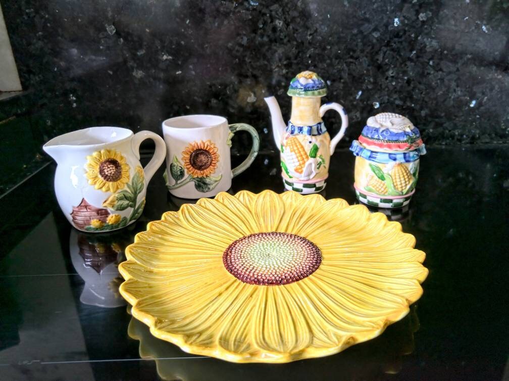 Lot of Sunny porcelain. Corn cob lidded jar and little jug. Sunflower plate, mug and jug.