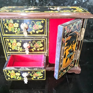 Vintage handpainted lacquer jewelry storage cabinet armoire.