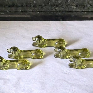 Set of five green pressed glass midcentury kniferests dog.