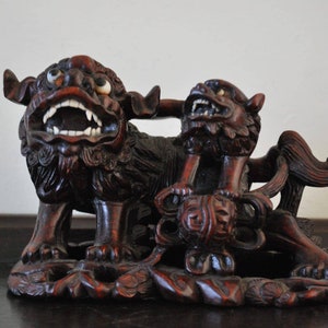 Handcarved wooden Foo dog lion guardian with pup.
