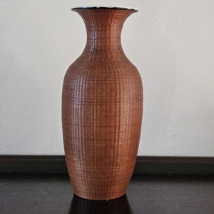 Chinese rattan woven bamboo fine vase. inside porcelain. mid centurion.