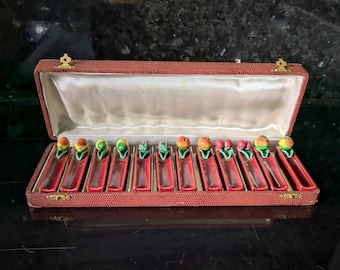 Vintage set of 12 ceramic majolica kniferests in original faux skin box. Fruit decoration.