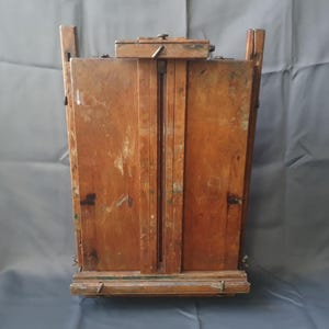 Ingeniosa caja y caballete plegables para pintores. Caballete portátil para artistas. Principios del siglo XX