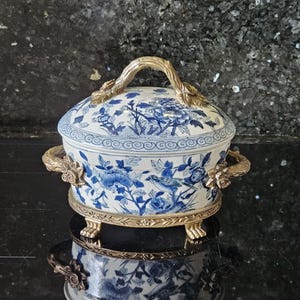 WL 1895 Wong Lee crackled porcelain lidded bowl with bronze decoration.