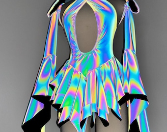 May include: Holographic iridescent dress with a hood and long sleeves. The dress features a keyhole neckline and a ruffled skirt. The sleeves have a flared design with black trim. The fabric reflects a rainbow of colors, creating a futuristic look.
