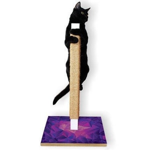 May include: A black cat climbs a beige scratching post with a purple and pink geometric patterned base. The cat is centered, with its paws gripping the post. The base is a wooden rectangle.