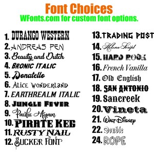 May include: A list of 24 font choices for custom font options. The list includes font names like Durango Western, Andreas Pen, Beauty and Dutch, Bronic Italic, Donatello, Alice Wonderland, Earthrealm Italic, Jungle Fever, Pacific Again, Pirate Keg, Rusty Nail, Sucker Font, Trading Post, Helena Script, Hard Rock, French Vanilla, Old English, San Antonio, Sancreek, Vineta, Walt Disney, Double, and Rope.