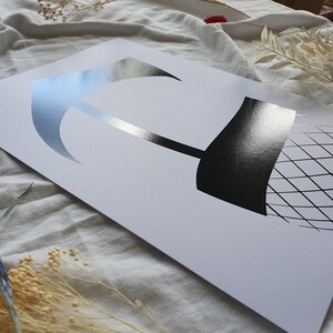 May include: A black and white illustration of a stylized leg wearing fishnet stockings. The image is printed on a white background.