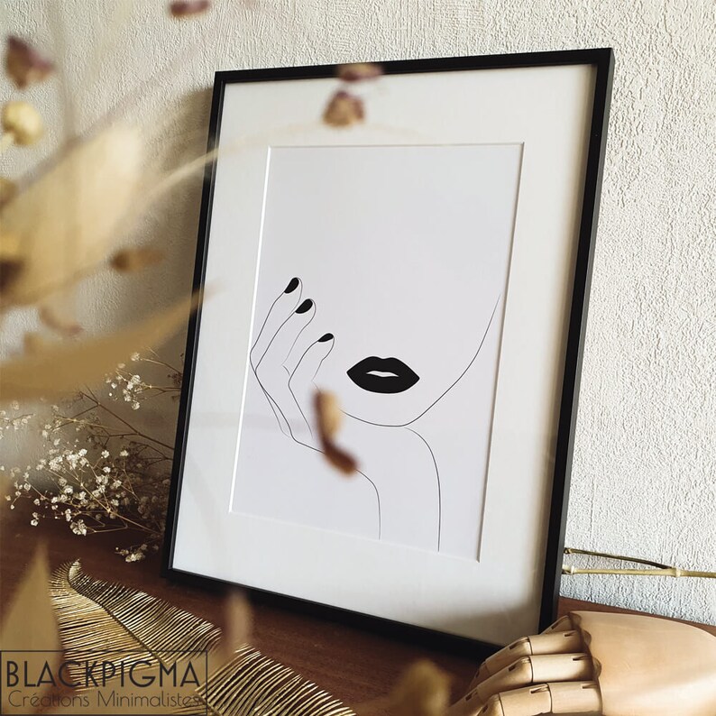May include: Black and white line art print of a woman's face with a hand resting on her chin. The woman's lips are painted black.
