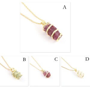 May include: Four gold necklaces with different coloured stones wrapped in gold wire. The stones are pink, green, pink and white.