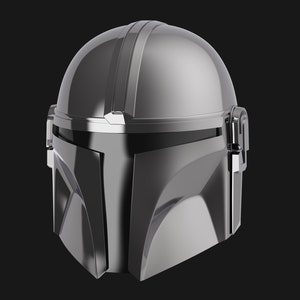 May include: A silver Mandalorian helmet with a visor and a textured surface.