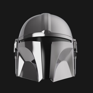 May include: A silver Mandalorian helmet with a visor and a T-shaped design on the front.