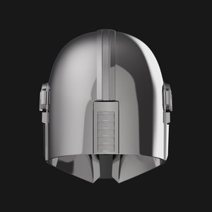 May include: A silver helmet with a raised ridge down the center and two small details on the sides. The helmet has a smooth, shiny finish.