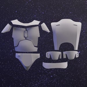 Può includere: Un kit di modellismo in plastica bianca di un'armatura futuristica. Il kit comprende un pezzo per il petto, un pezzo per la schiena e vari pezzi più piccoli.