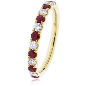May include: A gold band ring set with alternating round-cut rubies and diamonds. The ring has a polished finish and is marked with "18K". The gemstones are set closely together, creating a continuous sparkle.