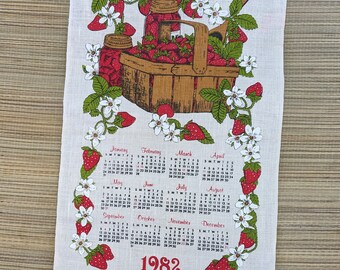 1982 linen hanging strawberry calender.