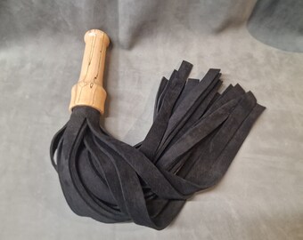 Heavy black suede flogger with waxed finish spalted beech handle and leather end cap