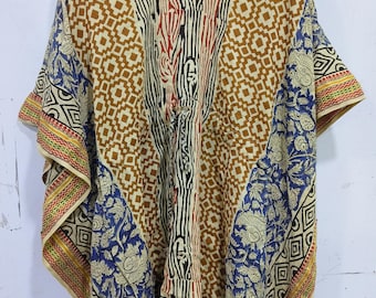 May include: A beige, brown, blue, and red printed cotton kaftan with a V-neck and short sleeves. The kaftan has a geometric pattern and floral designs.