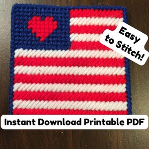 May include: A square, handmade needlepoint design featuring the American flag. The flag has a blue field with a red heart, and red and white stripes. The text "Easy to Stitch!" and "Instant Download Printable PDF" are also included.