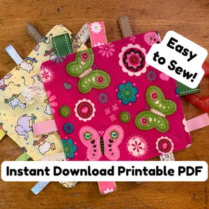 May include: Several baby tag blankets in the image, with different designs and colours. One has a yellow background with elephants and skateboards, another has a pink background with butterflies. A red teething ring is also present, along with the text "Easy to Sew!" and "Instant Download Printable PDF".