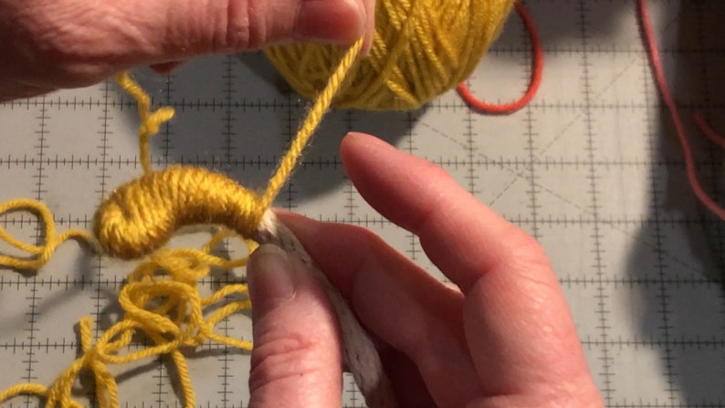 Step photo: Wrapping yarn