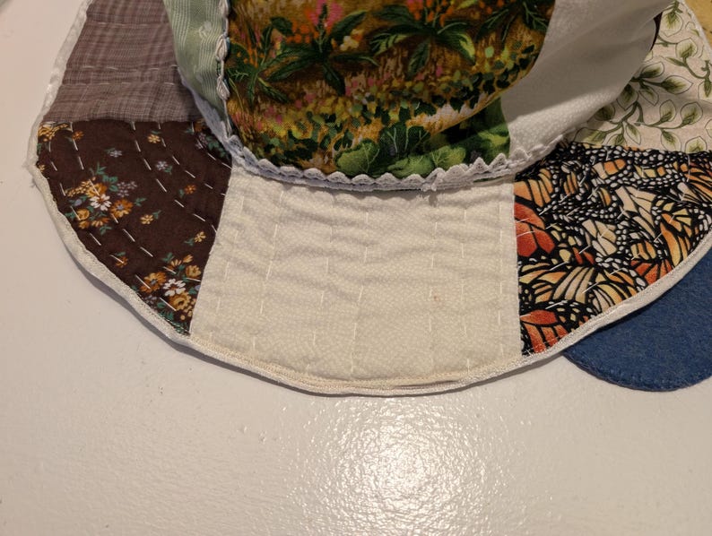 Slouchy Patchwork Hat closeup view of hand stitching on brim.