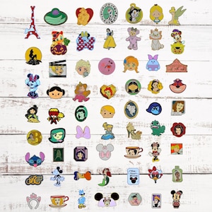 May include: A collection of 50 Disney character enamel pins featuring various characters from classic Disney movies and shows. The pins are displayed on a white wooden background.