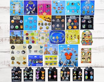 May include: A collection of 40 Disney character pins, featuring characters from Star Wars, Disney Villains, Stitch, and more. The pins are displayed on a white wooden background.