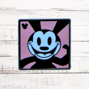 May include: Square, black-bordered image featuring a cartoon character with a light blue face and a large, smiling mouth. The character has black ears and a black body. The background is a light purple color with black rays emanating from the top. A Mickey Mouse icon is in the upper left corner.