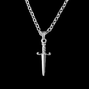 May include: A silver chain necklace with a silver dagger pendant.