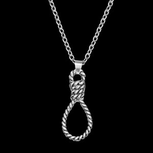 May include: A silver necklace with a pendant shaped like a noose. The pendant is made of twisted metal and has a rope-like texture.