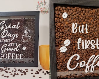 May include: Two framed shadow boxes filled with coffee beans and white vinyl lettering. The first box says "Great Days Start With Good Coffee" and the second box says "But First, Coffee".