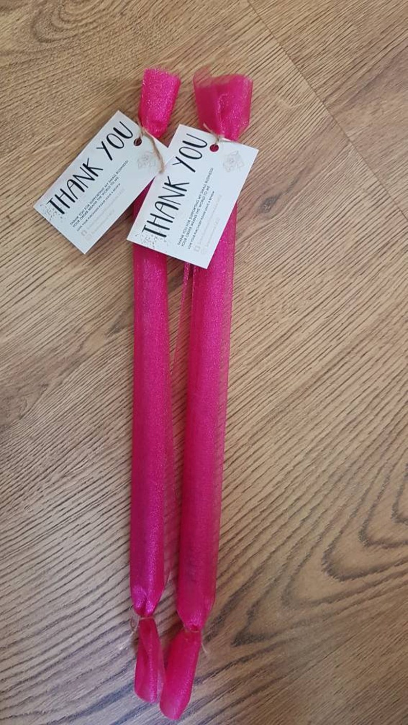 May include: Two pink tulle gift bags with thank you tags attached. The tags say "Thank you for your support! Small businesses like ours couldn't exist without you!"