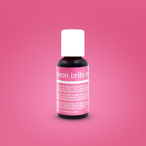 May include: A small bottle of neon pink food coloring with a white cap. The label reads "neon brite pink" and lists ingredients in English and Spanish.