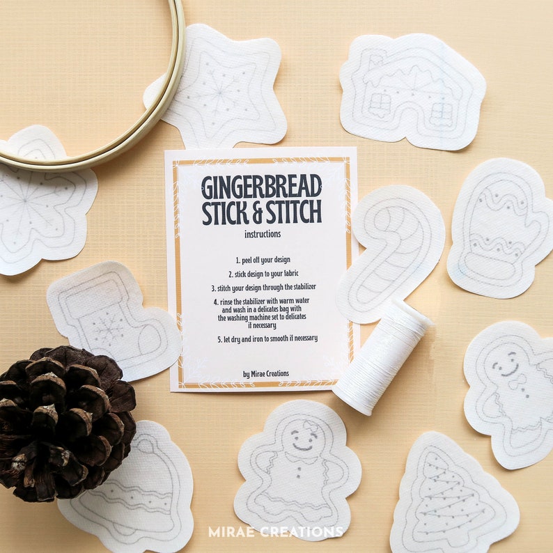 May include: A set of gingerbread stick and stitch patterns featuring a gingerbread house, a candy cane, a stocking, a gingerbread person, a Christmas tree, and a mitten. The patterns are printed on white fabric and are ready to be stitched.