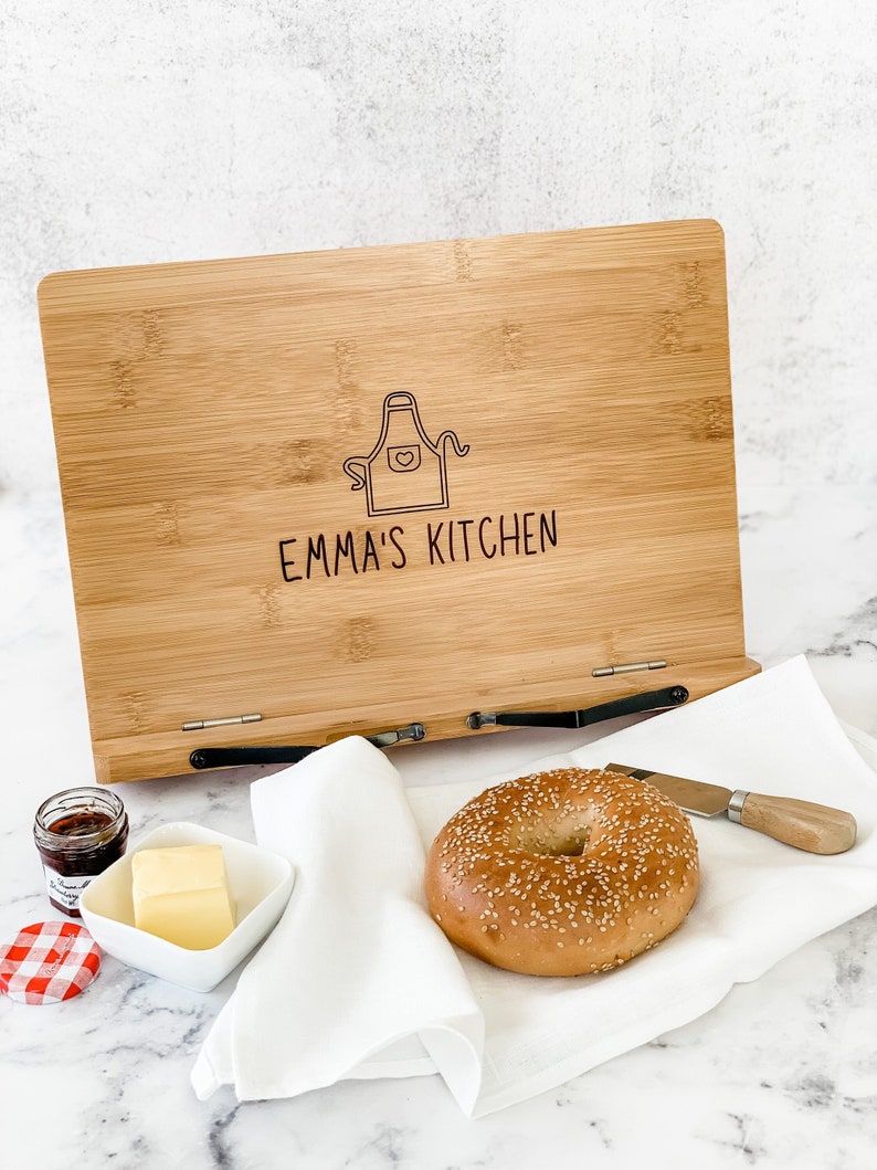 Personalized wooden recipe holder or customized cookbook holder for cookbooks and family recipes. Cookbook stand gift bundle that comes with a drawstring bag and a bookmark.