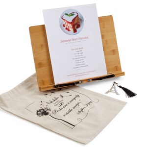 Personalized wooden recipe holder or customized cookbook holder for cookbooks and family recipes. Cookbook stand gift bundle that comes with a drawstring bag and a bookmark.