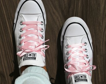 tan shoes and pink shoelaces