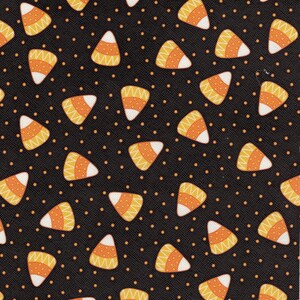 May include: A black fabric with a repeating pattern of orange and white candy corn shapes on a black background with small orange dots.