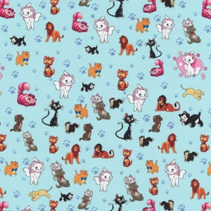 May include: A blue fabric with a repeating pattern of cartoon cats, lions, and paw prints. The cats are white with pink ears and noses, and the lions are orange with brown manes. The paw prints are blue.