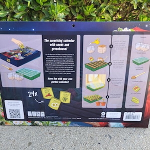 May include: A calendar with seeds and a greenhouse, featuring instructions and illustrations for planting. The calendar includes a small greenhouse, soil tablets, and seed packets. The text on the calendar reads "The surprising calendar with seeds and greenhouse!"