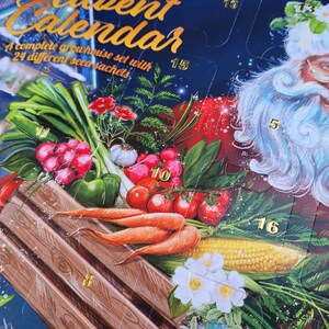 May include: Advent calendar with a Santa Claus illustration and a complete greenhouse set with 24 different seed packets. The calendar features illustrations of vegetables like carrots, tomatoes, and corn.